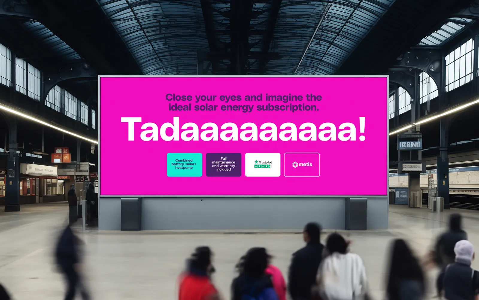 A station billboard in the Metis identity reading ‘Tadaaaaaaaa!’.