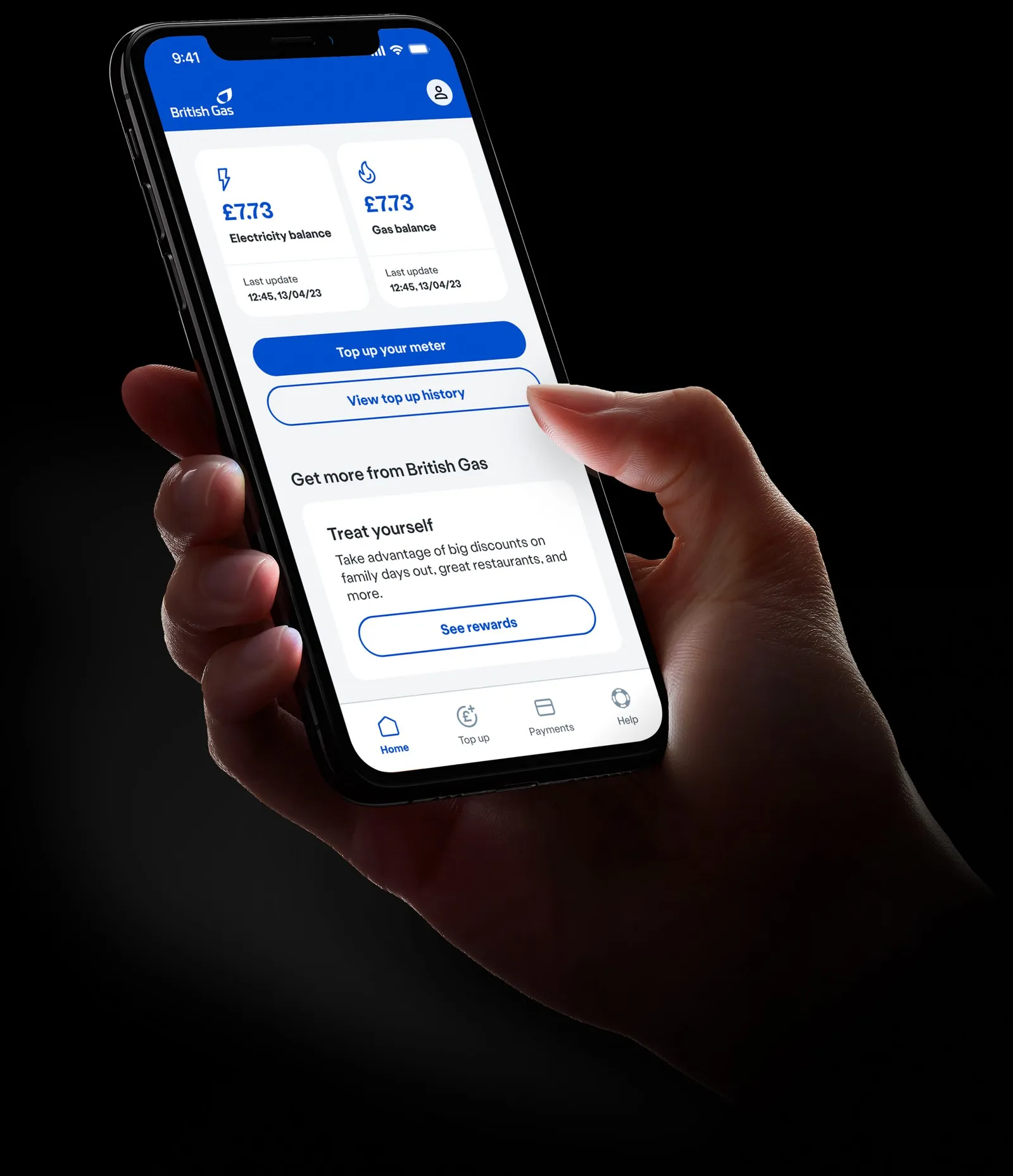 A hand holding a phone showing a British Gas account screen.